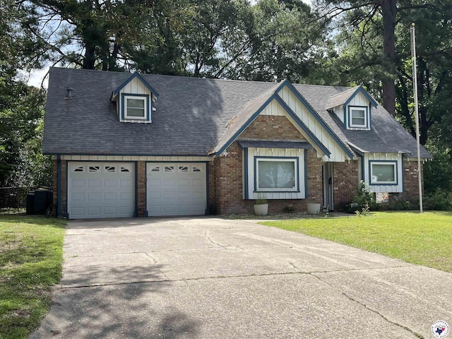 24 Desoto Cir, Texarkana, TX 75503 - view of front of house with concrete driveway, a front lawn, roof with shingles, brick siding, and board and batten siding