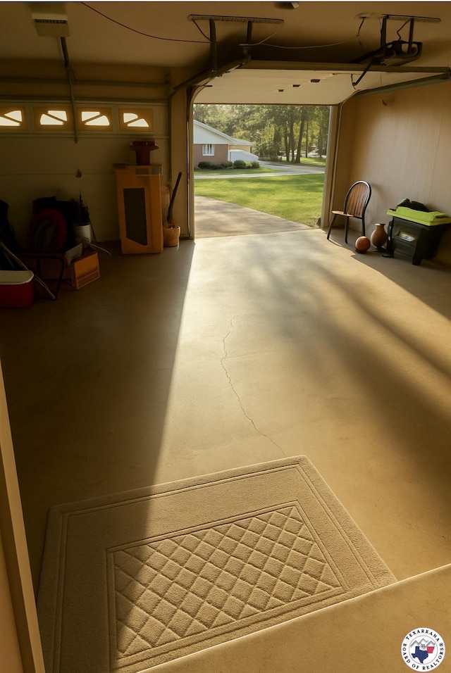 24 Desoto Cir, Texarkana, TX 75503 - garage featuring a garage door opener