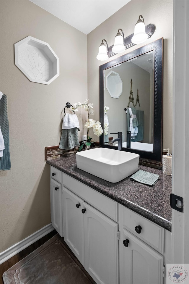 bathroom featuring hardwood / wood-style floors and vanity