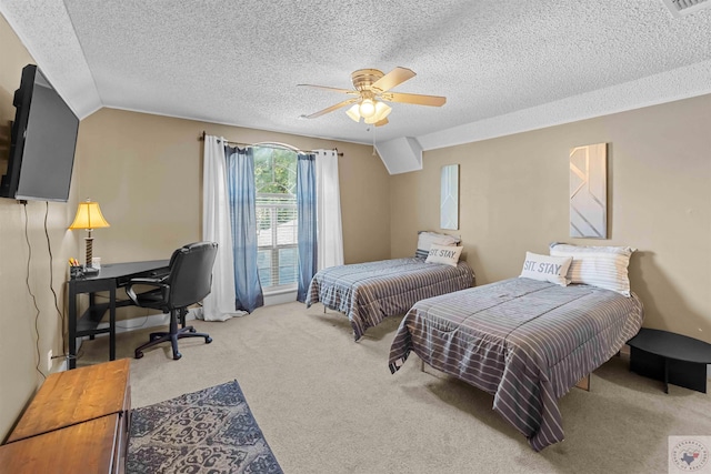 bedroom featuring ceiling fan, carpet, a textured ceiling, and vaulted ceiling