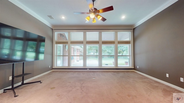 carpeted empty room featuring ceiling fan and ornamental molding