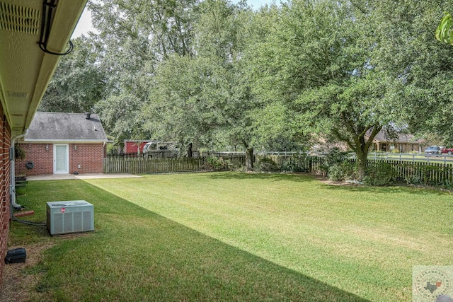 view of yard with central AC unit