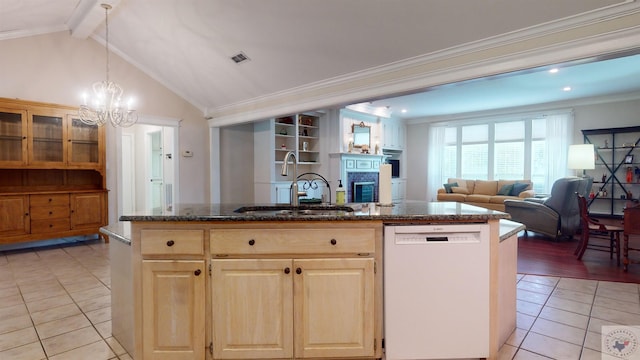 kitchen featuring white dishwasher, sink, a center island with sink, and crown molding