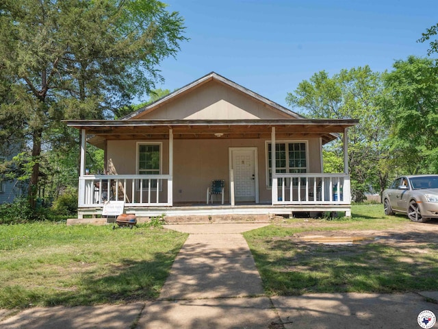 2019 Hazel St, Texarkana, TX 75501 - view of front of property with a porch and a front yard