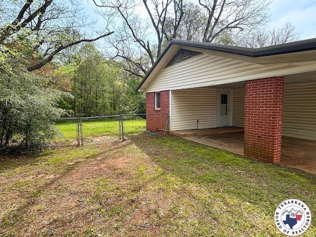 120 N St, Douglassville, TX 75560 - view of yard featuring a gate, a carport, and fence