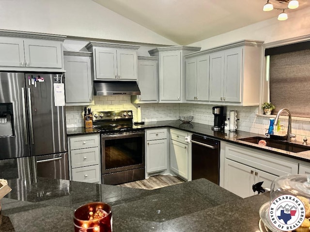 19913 Fm 125, Bivins, TX 75555 - kitchen with vaulted ceiling, backsplash, under cabinet range hood, appliances with stainless steel finishes, and a sink