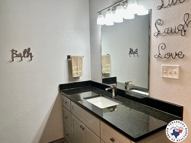 19913 Fm 125, Bivins, TX 75555 - bathroom featuring a textured wall and vanity