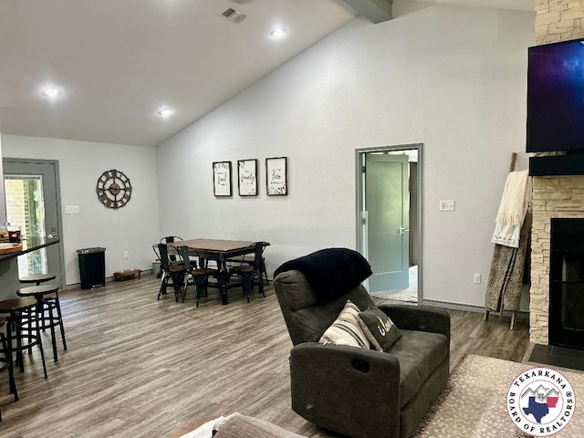 19913 Fm 125, Bivins, TX 75555 - living area with beamed ceiling, a fireplace, visible vents, wood finished floors, and baseboards