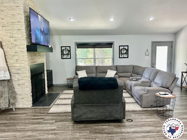 19913 Fm 125, Bivins, TX 75555 - living room featuring wood finished floors, a fireplace, baseboards, and recessed lighting