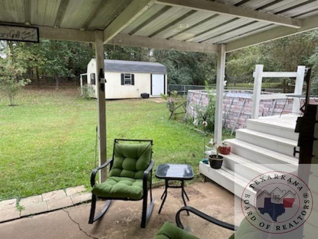 view of patio featuring a shed