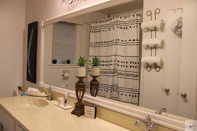 bathroom featuring vanity and a shower with curtain