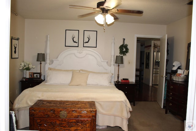 bedroom with carpet flooring, stainless steel fridge with ice dispenser, and ceiling fan