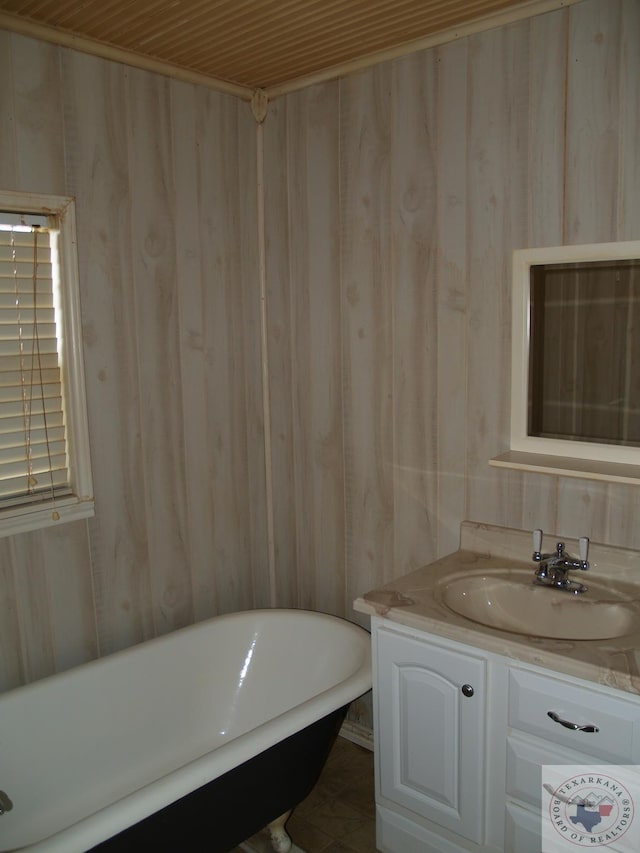 bathroom featuring wood ceiling, tile patterned floors, vanity, a bathtub, and wood walls