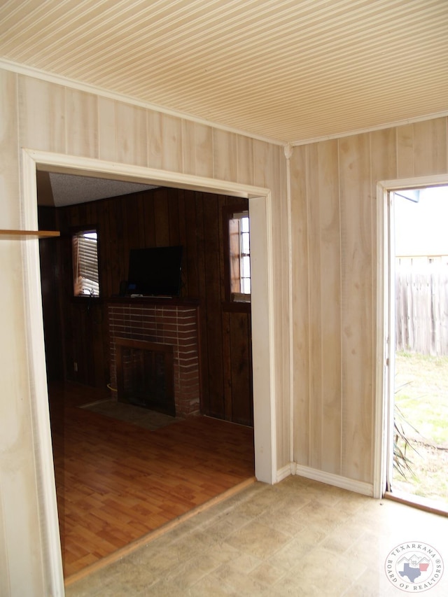 unfurnished living room with a brick fireplace