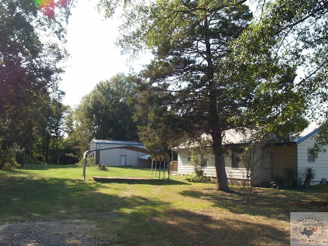 view of yard with a carport