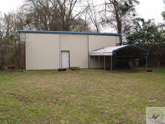 view of outdoor structure featuring a lawn and a carport