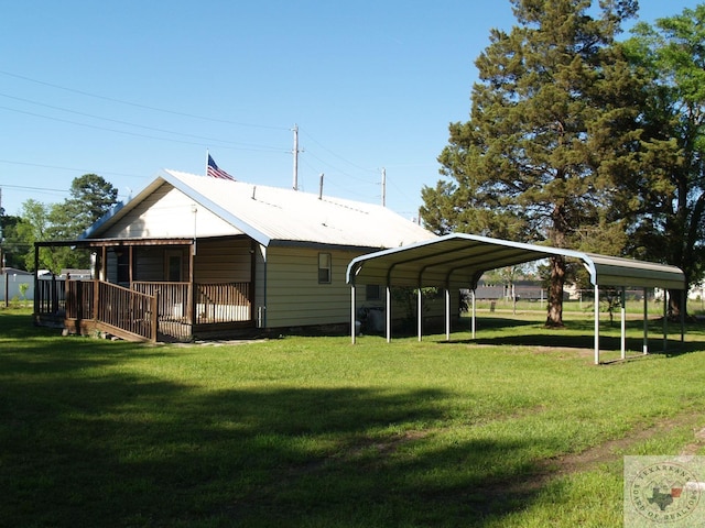 exterior space featuring a yard and a carport