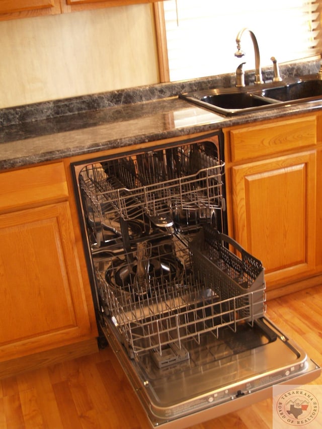 details featuring hardwood / wood-style flooring and sink