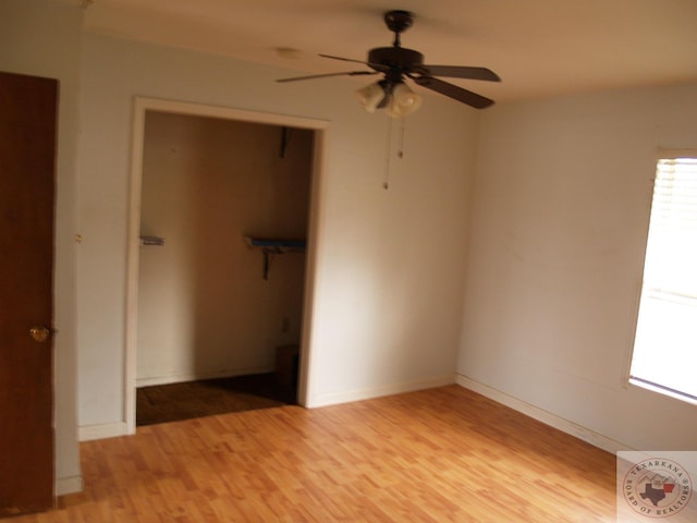 unfurnished bedroom with a closet, ceiling fan, and light hardwood / wood-style flooring