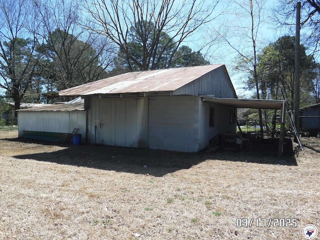view of outbuilding with an attached carport