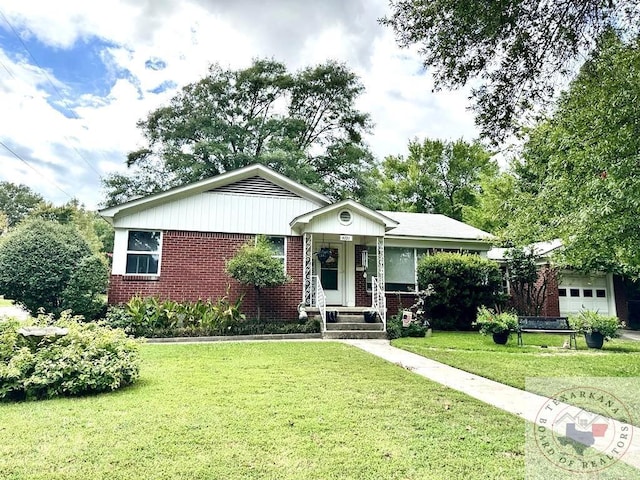 ranch-style house with a garage and a front yard