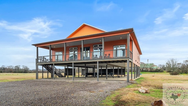 view of front of home featuring stairway and a front yard