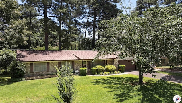 814 Hawkins Ave, Wake Village, TX 75501 - view of front of property featuring driveway, a garage, a front lawn, and metal roof