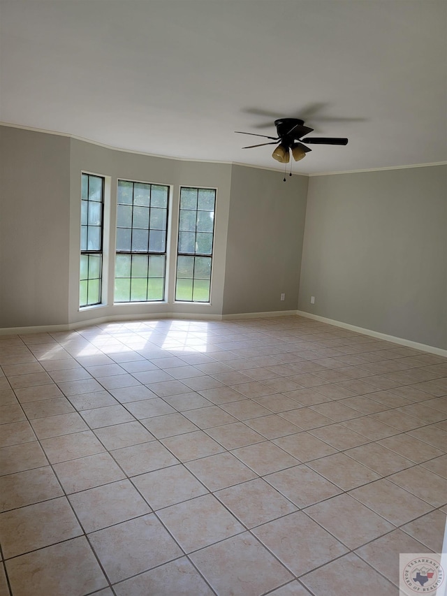 spare room featuring light tile patterned floors and ceiling fan