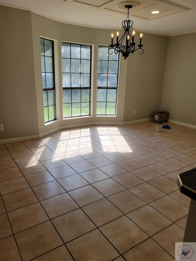 tiled empty room with a notable chandelier and ornamental molding