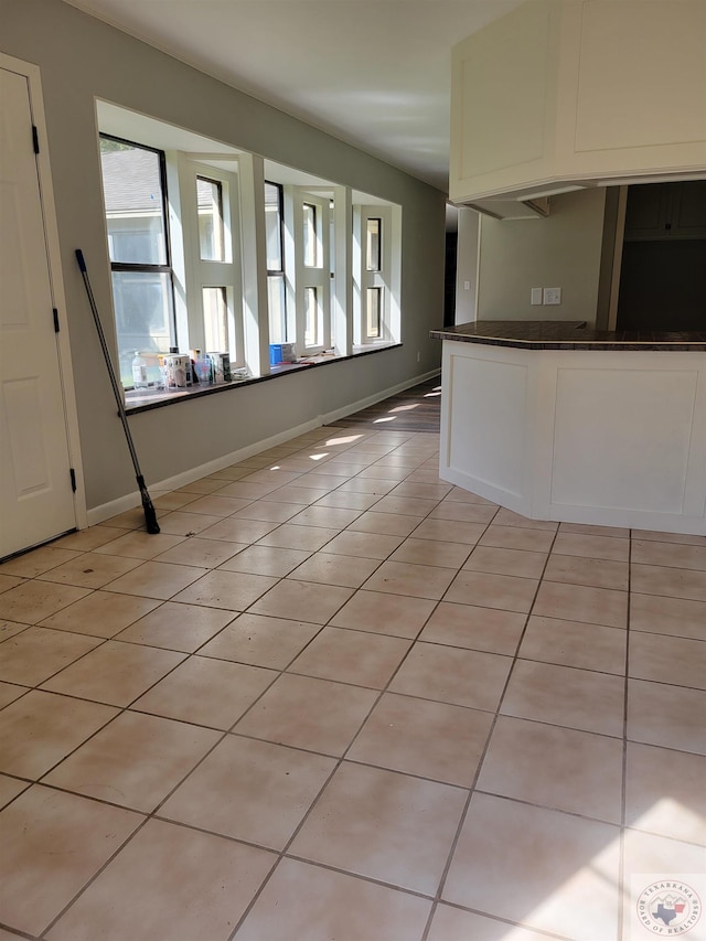 interior space with light tile patterned floors