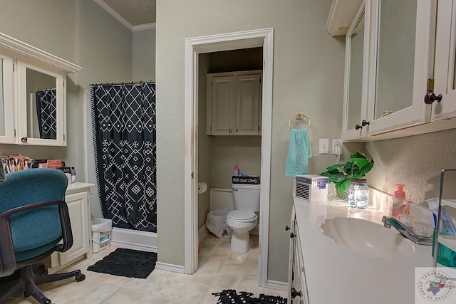 bathroom with ornamental molding, toilet, walk in shower, and vanity