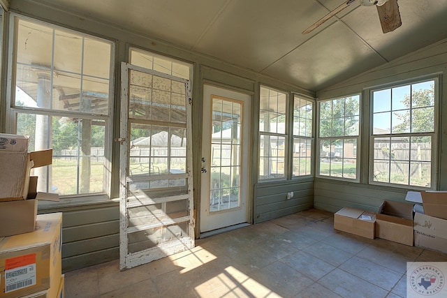 sunroom featuring vaulted ceiling, a wealth of natural light, and ceiling fan