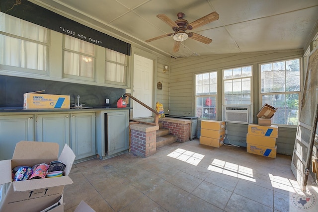 interior space with vaulted ceiling, ceiling fan, and cooling unit