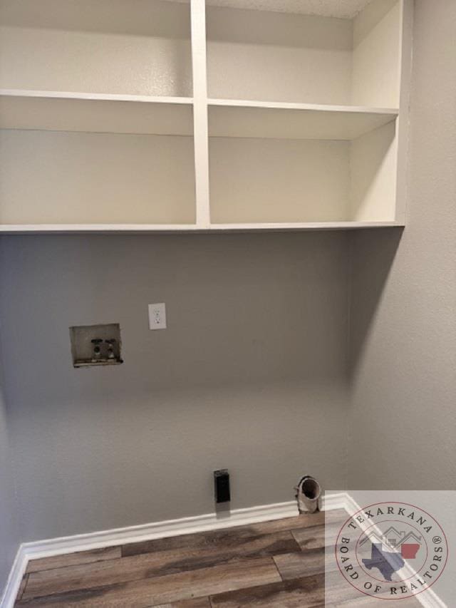 laundry area with dark wood-type flooring and washer hookup