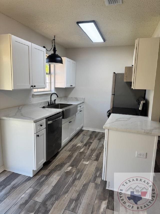 kitchen featuring white cabinets, a textured ceiling, dark hardwood / wood-style floors, and stainless steel dishwasher