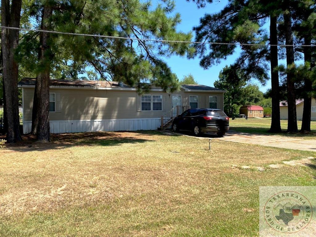 124 Pearlie St, New Boston, TX 75570 - exterior space with a front lawn