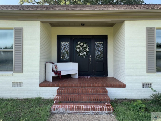 entrance to property with covered porch