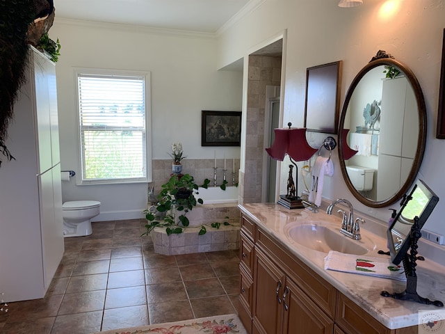 bathroom featuring vanity, toilet, crown molding, and tile patterned flooring