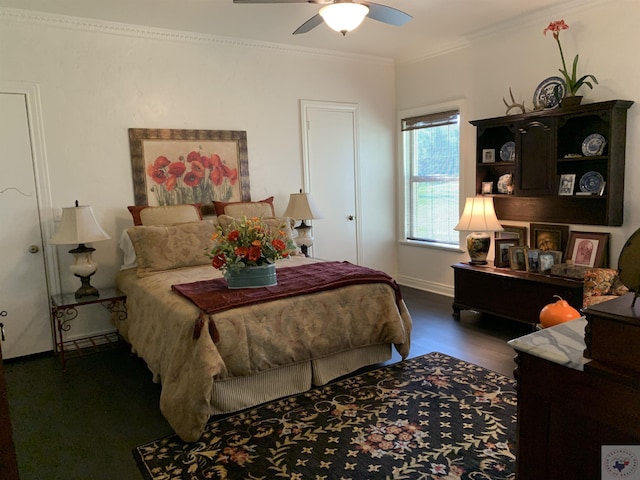 bedroom with ceiling fan, crown molding, and dark wood-type flooring