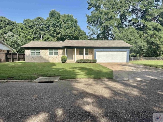 single story home featuring a garage and a front lawn