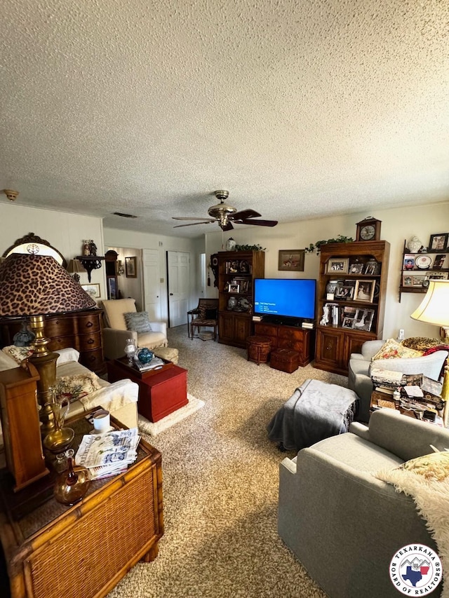 1509 W 40th St, Texarkana, TX 75503 - carpeted living area featuring a textured ceiling and ceiling fan