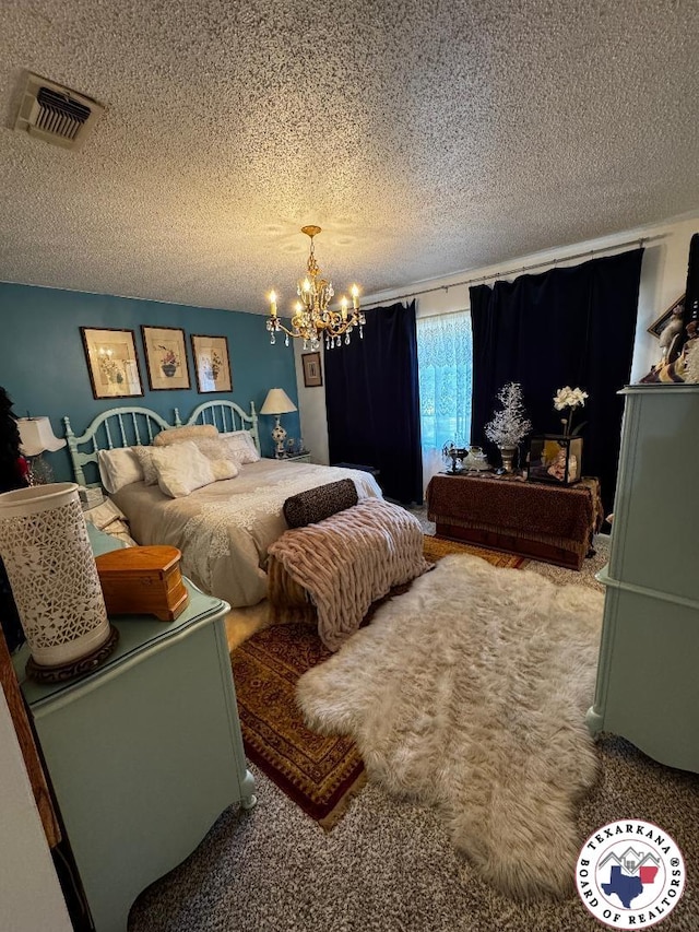 1509 W 40th St, Texarkana, TX 75503 - bedroom with a textured ceiling, a chandelier, and carpet