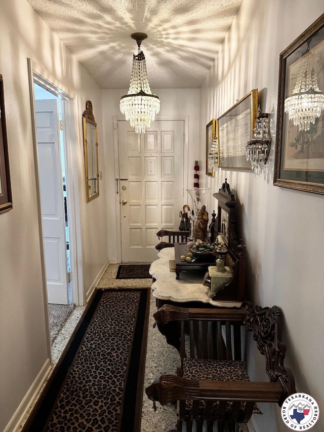 1509 W 40th St, Texarkana, TX 75503 - doorway to outside with a chandelier and a textured ceiling