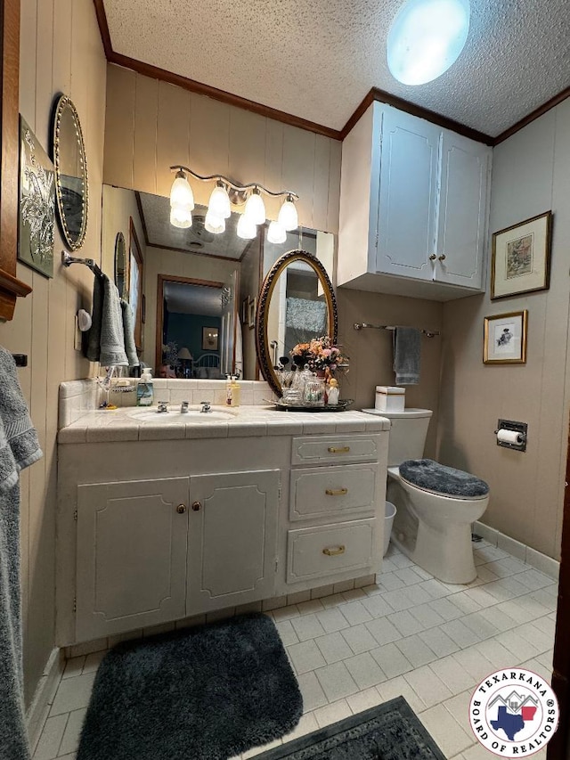 1509 W 40th St, Texarkana, TX 75503 - bathroom featuring ornamental molding, tile patterned floors, vanity, and a textured ceiling