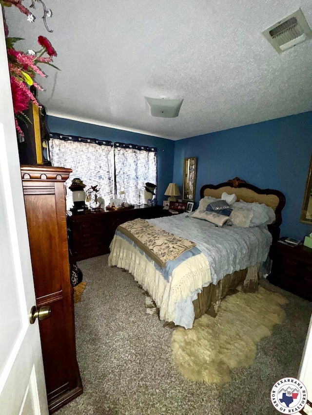 1509 W 40th St, Texarkana, TX 75503 - carpeted bedroom featuring a textured ceiling