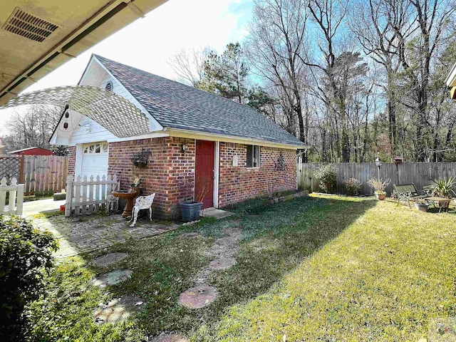 view of yard featuring a garage