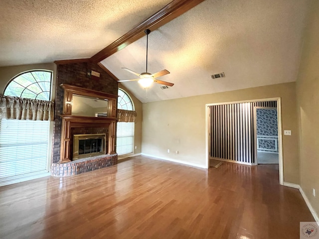 130 Westline Rd, Wake Village, TX 75501 - unfurnished living room featuring a textured ceiling, wood finished floors, healthy amount of natural light, a ceiling fan, and baseboards