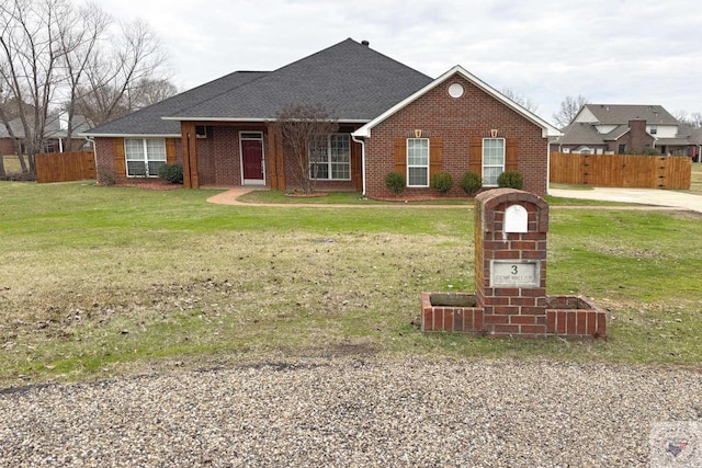 single story home with a front yard