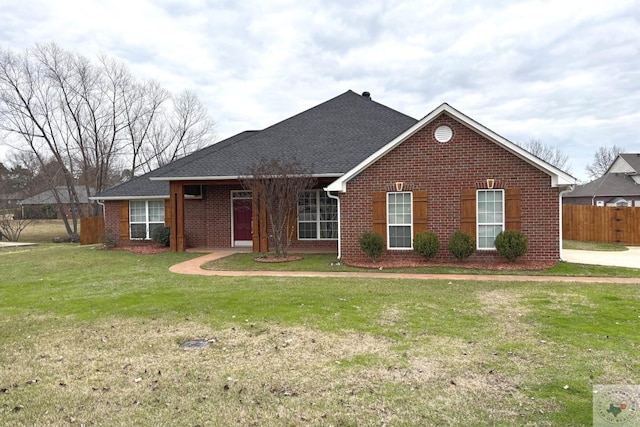 ranch-style home featuring a front yard