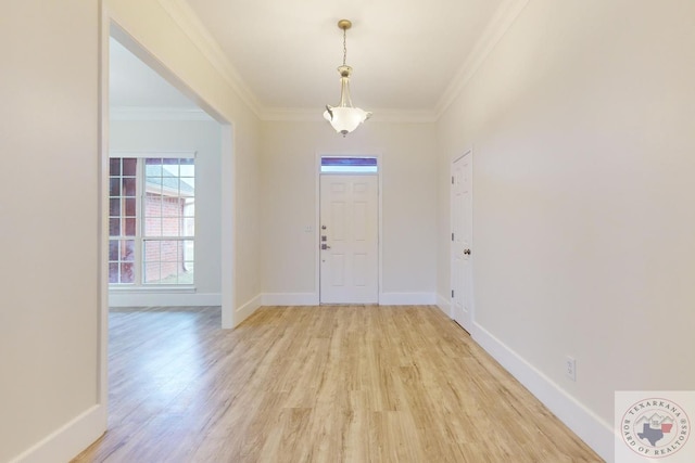 entrance foyer featuring light hardwood / wood-style flooring and ornamental molding